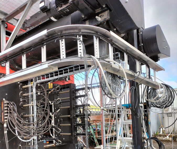 Electricians wiring industrial control panel in Hamilton